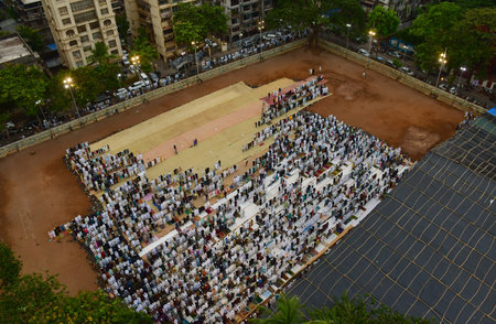 MUMBAI, INDIA - JUNE 17: Muslim Devotees offer morning prayers on the occasion of Bakri Eid at a YMCA ground, on June 17, 2024 in Mumbai, India. Photo by Bhushan Koyande/Hindustan Times )のeditorial素材