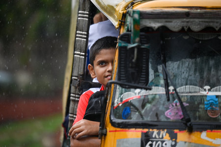 NOIDA, INDIA - JULY 10: Commuters step out during afternoon rain, which brought down the humidity...