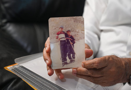 NOIDA, INDIA - JULY 11: Father Colonel VN Thapar showing photograph of martyr Captain Vijayant Thapar  at his residence at Arun Vihar on July 11, 2024 in Noida, India. Captain Vijayant Thapar was martyred in the Kargil War. (Photo by Sunil Ghosh/Hindustanのeditorial素材