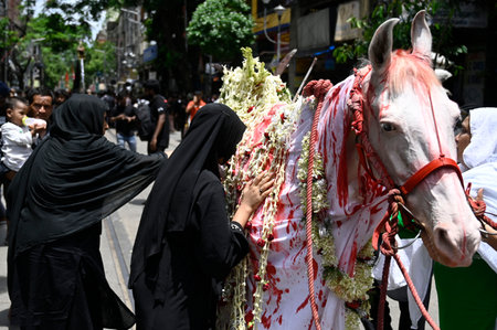 KOLKATA, INDIA - JULY 17: Shiite (Shia) Muslim seen during a religious procession to mark Ashura on the tenth day of the Islamic month of Muharram to mourn the martyrdom of Hussain, grandson of Prophet Mohammad at Central Avenue on July 17, 2024 in Kolkatのeditorial素材