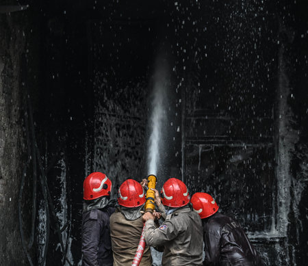 NEW DELHI, INDIA - JULY 24:  Firefighters seen trying to douse off fire gutted inside a plastic...