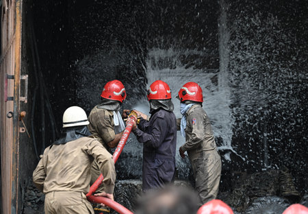 NEW DELHI, INDIA - JULY 24:  Firefighters seen trying to douse off fire gutted inside a plastic...