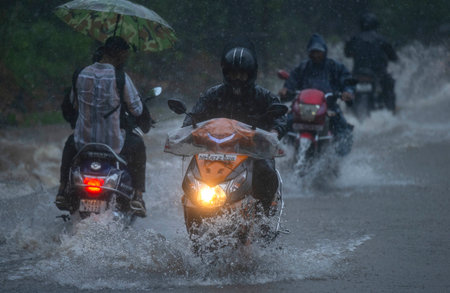 MUMBAI, INDIA - JULY 25: People going through the logging water at Aarey colony  on July 25, 2024 in Mumbai, India.  (Photo by Satish Bate/Hindustan Times)のeditorial素材