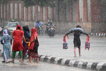 NEW DELHI, INDIA - JULY 27: People during rainfall in evening hours, Near Nehru Place, on July 27, 2024 in New Delhi, India. (Photo by Salman Ali/Hindustan Times )のeditorial素材