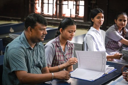 NEW DELHI, INDIA - JULY 27: Students along with their parents seen interacting with teachers during Mega PTM in the schools of Delhi Government at Swami Dayanand SKV School, Old Rajendra Nagar, on July 27, 2024 in New Delhi, India. (Photo by Sanchit Khannのeditorial素材