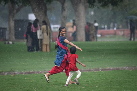 NEW DELHI, INDIA - JULY 27: People seen during sudden rains at India Gate, on July 27, 2024 in New Delhi, India. (Photo by Sanchit Khanna/Hindustan Times )のeditorial素材