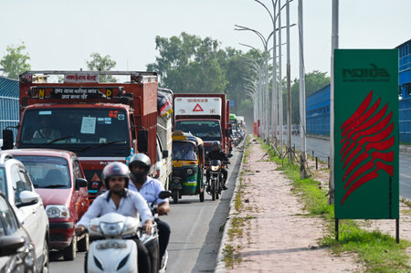 NOIDA, INDIA - JULY 27: Noida Traffic Police has route diversion one side of the road coming from Kalindi Kunj to Noida for Kanwariyas. There was a jam due to the route diverging, on July 27, 2024 in Noida, India. The Kanwar Yatra is an annual pilgrimage のeditorial素材