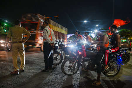 NOIDA, INDIA - JULY 29: Kanwariyas carrying holy water collected from River Ganga in Haridwar going back to their hometown during the Kanwar Yatra at Sector 14 A on July 29, 2024 in Noida, India. People will celebrate the Sawan Shivratri on 02 August acroのeditorial素材