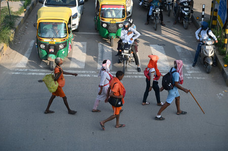 GURUGRAM, INDIA - JULY 29: Kanwariyas carrying holy water collected from River Ganga in Haridwar going back to their hometown during the Kanwar Yatra at National Highway-48 near Iffco Chowk on July 29, 2024 in Gurugram, India. People will celebrate the Saのeditorial素材