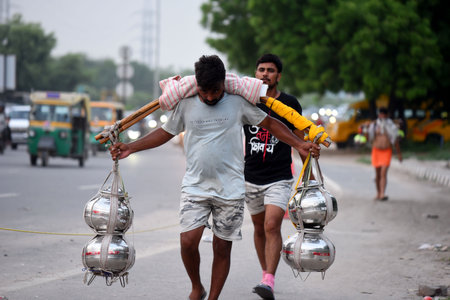 GURUGRAM, INDIA - JULY 30:  Kanwariyas carrying holy water in collected from River Ganga in Haridwar...