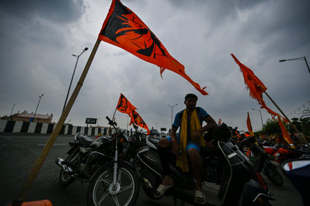 NEW DELHI, INDIA - JULY 31: Kanwariyas carry holy water collected from Ganga River in Haridwar under the Black Clouds during Kanwar Yatra near Akshardham Crossing  on July 31, 2024  in New Delhi, India.  (Photo by Raj K Raj/Hindustan Times)のeditorial素材