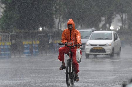 KOLKATA, INDIA - AUGUST 1:  Commuters pass on a road during rain   on August 1, 2024 in Kolkata, India.  (Photo by Samir Jana/Hindustan Times)のeditorial素材