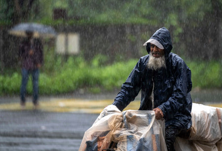 MUMBAI, INDIA - AUGUST 3: People going through the rain at Vikhroli, on August 3, 2024 in Mumbai, India. (Photo by Satish Bate/Hindustan Times )のeditorial素材