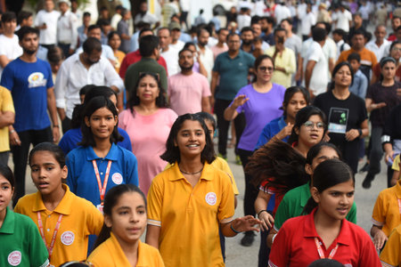 GURUGRAM, INDIA - AUGUST 4: People participated in various activities like cycling, Ludo, Skateboard, Snakes and Ladders, Zumba dance, yoga, badminton, cricket and carrom board etc on the Raahgiri Day at Surya Vihar Main Road organized by District Adminisのeditorial素材