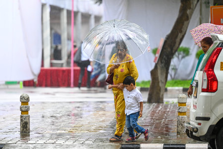 NEW DELHI, INDIA - AUGUST 10: People seen during sudden rainfall at IIT Delhi, on August 10, 2024 in New Delhi, India. (Photo by Sanchit Khanna/Hindustan Times )のeditorial素材