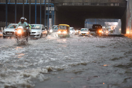 GURUGRAM, INDIA - AUGUST 11: Vehicles wade through a waterlogged stretch during the heavy rain in Subhash Chowk underpass at Sohna road, on August 11, 2024 in Gurugram, India. (Photo by Parveen Kumar/Hindustan Times )のeditorial素材