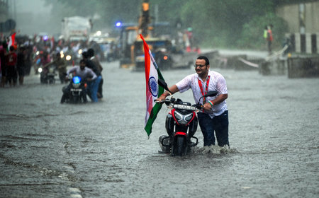 NEW DELHI, INDIA - AUGUST 11: A Bike has broken down on a waterlogged stretch near Vinod Nagar on...