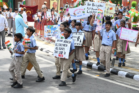 NEW DELHI, INDIA - AUGUST 9: School children with National Flag and Placards raising awareness on Social Evils as part of Har Ghar Tiranga Abhiyaan march from Gandhi Darshan, Rajghat to Charti Lal Goel Heritage Park near Red Fort, commemorating the 82nd Aのeditorial素材