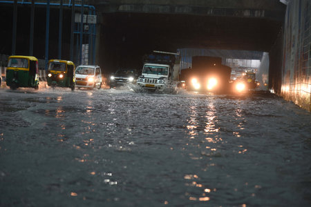 GURUGRAM, INDIA - AUGUST 11: Vehicles wade through a waterlogged stretch during the heavy rain in Subhash Chowk underpass at Sohna road, on August 11, 2024 in Gurugram, India. (Photo by Parveen Kumar/Hindustan Times )のeditorial素材