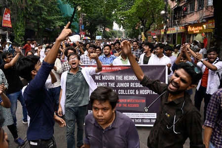 KOLKATA, INDIA - AUGUST 12:  Doctors, medical students, nursing staffs along with other activists take out a protest rally from College street against alleged rape and murder of a PGT woman doctor of R G Kar Medical College & Hospital on August 12, 2024 iのeditorial素材