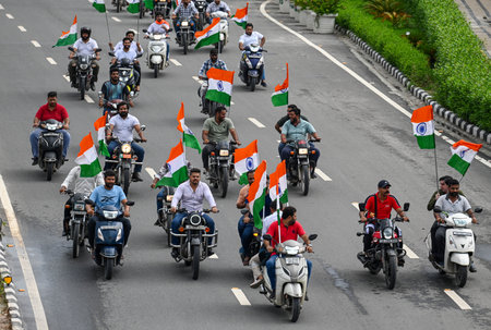 NEW DELHI, INDIA - AUGUST 13: People participate during the Har Ghar Tiranga Bike Rally flagged off...