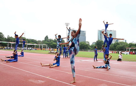 GURUGRAM, INDIA - AUGUST 15: Students performing aerobic yoga during 78th Independence Day celebrations at Tau Devi Lal Stadium in sector-38 near Rajiv chowk, on August 15, 2024 in Gurugram, India. The theme of this year's Independence Day is 'ViksitBharaのeditorial素材