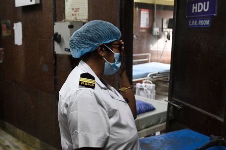 KOLKATA, INDIA - AUGUST 15: A senior nurse break down in tear looking the destruction after the vandalism by unidentified mob at Emergency department in RG Kar Medical College & Hospital shortly after midnight 'Reclaim the Night' protest against rape and のeditorial素材