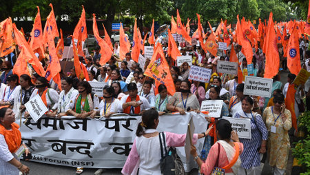 NEW DELHI, INDIA - AUGUST 16: Members and supporters of Nari Shakti Forum hold a protest march from Mandi House to Jantar Mantar against the atrocities being committed on minorities in Bangladesh, on August 16, 2024 in New Delhi, India. (Photo by Sonu Mehのeditorial素材