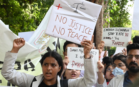 NEW DELHI, INDIA - AUGUST 16: Members of Resident Doctors Associations (RDAs) across Delhi during a joint protest march against the alleged rape and murder of a woman doctor at Kolkatas R G Kar Medical College and Hospital, in front of Nirman Bhavan, on Aのeditorial素材