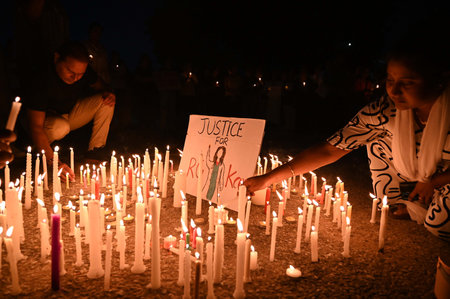 GURUGRAM, INDIA - AUGUST 18: Around 500 people participate in candlelight vigil and peaceful protest over the rape and murder of a doctor in Kalkata at the Parking ground of Leisure Valley Park at sector-29 near Huda Market, on August 18, 2024 in Gurugramのeditorial素材