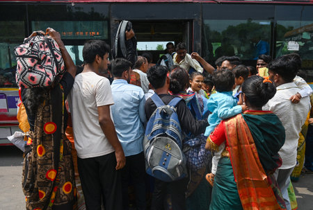 NOIDA, INDIA - AUGUST 19: A view of a huge crowd of passengers waiting for DTC bus at Sector 37 bus...