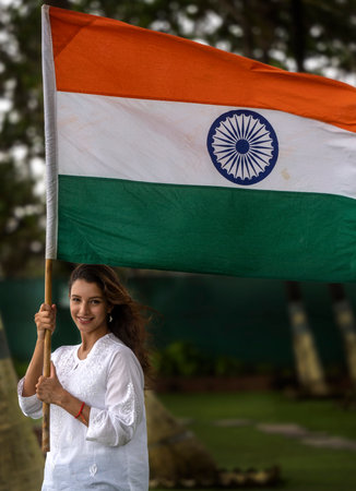 MUMBAI, INDIA - AUGUST 7: (EDITOR'S NOTE: This is an exclusive image of Hindustan Times) Bollywood actor Tripti Dimri poses with the Indian flag during an exclusive interview with HT City on Independence Day at Novotel Mumbai Juhu Beach, on August 7, 2024のeditorial素材