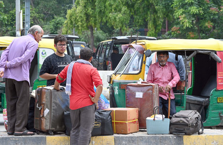NEW DELHI, INDIA - AUGUST 22: Commuters outside New Delhi Railway Station during a 2-day strike called by auto and taxi driver unions to protest against the app-based cab services on August 22, 2024 in New Delhi, India. (Photo by Sanjeev Verma/Hindustan Tのeditorial素材