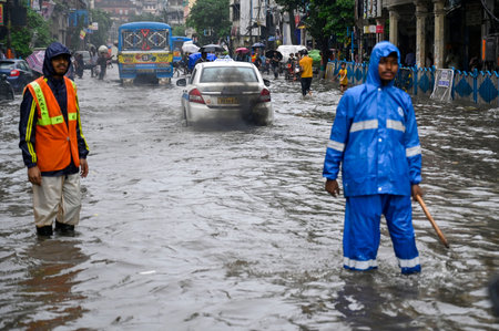 KOLKATA, INDIA - AUGUST 24: People and car wade through water logged street after heavy afternoon rain at Central Avenue on August 24, 2024 in Kolkata, India. (Photo by Samir Jana/Hindustan Times )のeditorial素材