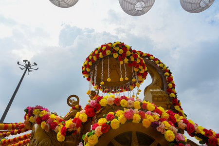 NOIDA, INDIA - AUGUST 24: In preparation for Janmashtami at ISKCON temple located in Sector 33, the chariot was decorated with colorful flowers, showing Lord Krishna giving Geeta sermon to Arjun, on August 24, 2024 in Noida, India. (Photo by Sunil Ghosh/Hのeditorial素材