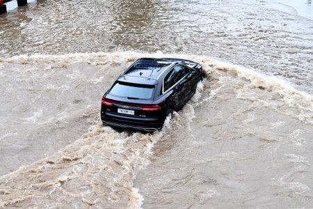 NEW DELHI, INDIA - AUGUST 23: Commuters wade through waterlogged roads near Dhaula Kuan flyover...