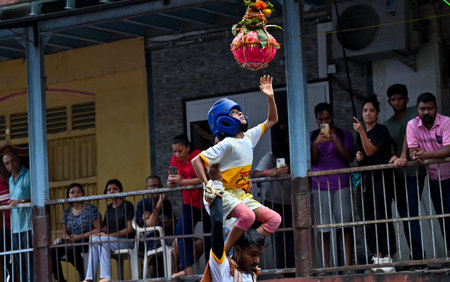 MUMBAI, INDIA - AUGUST 27: Govinda Revellers from human pyramid to break earthen pot\"Dahi Hand\" while celebrating the Hindu Festival of \"Gopalkala\" at Dadar on August 27, 2024 in Mumbai, India. (Photo by Anshuman Poyrekar/Hindustan Times)のeditorial素材