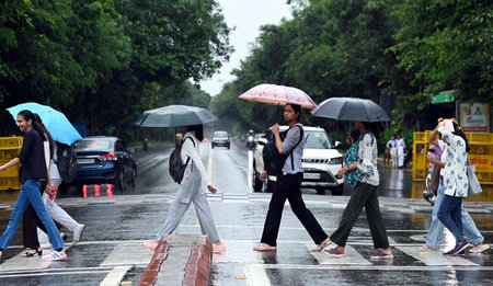 NEW DELHI, INDIA - SEPTEMBER 4 2024  People out in the rain at Mandi House , on September 4, 2024 in New Delhi, India. Delhi residents witnessed a sudden change in weather as heavy rain lashed several parts of the city. (Photo by Arvind Yadav/Hindustan Tiのeditorial素材