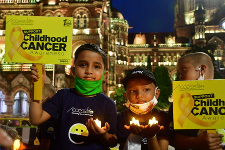 MUMBAI, INDIA - SEPTEMBER 4 2024  Cancer-affected children were seen holding candles in front of Mumbaiのeditorial素材