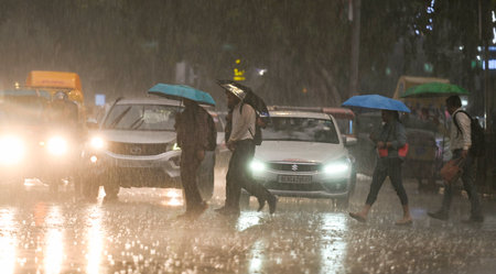 NEW DELHI, INDIA - SEPTEMBER 5 2024  People walking under the dark Cloud during the heavy Rain at Connaught place, on September 5, 2024 in New Delhi, India. (Photo by Raj K Raj/Hindustan Times )のeditorial素材