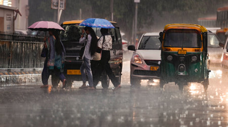 NEW DELHI, INDIA - SEPTEMBER 5 2024  People walking under the dark Cloud during the heavy Rain at Connaught place, on September 5, 2024 in New Delhi, India. (Photo by Raj K Raj/Hindustan Times )のeditorial素材