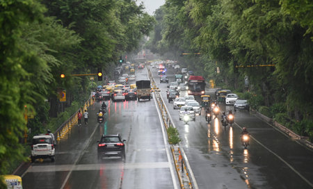NEW DELHI, INDIA - SEPTEMBER 4 2024  Commuters out on rain near Tilak Bridge , on September 4, 2024 in New Delhi, India. Delhi residents witnessed a sudden change in weather as heavy rain lashed several parts of the city. (Photo by Sanjeev Verma/Hindustanのeditorial素材