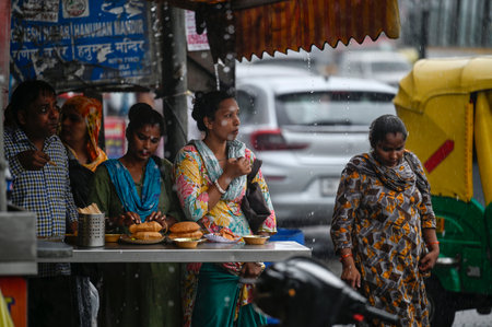 NEW DELHI, INDIA - SEPTEMBER 4 2024  People seen out during rain near Pandav Nagar , on September 4, 2024 in New Delhi, India. Delhi residents witnessed a sudden change in weather as heavy rain lashed several parts of the city. (Photo by Raj K Raj/Hindustのeditorial素材