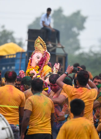 NOIDA, INDIA - SEPTEMBER 8: Devotees gather at the Yamuna River during the immersion ceremony on the...