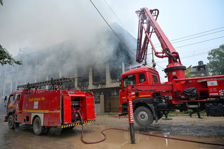 NEW DELHI, INDIA - SEPTEMBER 8: Firefighters try to douse the fire at Textile Factory In Bakkarwala...