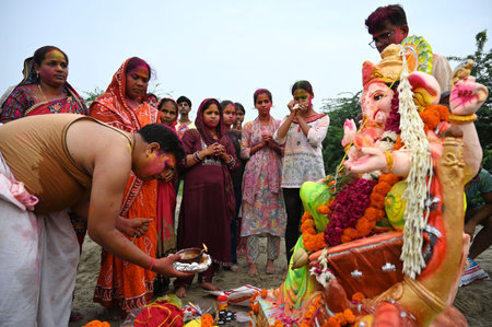 NEW DELHI, INDIA - SEPTEMBER 8 2024  Devotees gathered for the immersion of Lord Ganesh idols at...