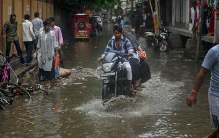 NEW DELHI, INDIA - SEPTEMBER 9 2024Local Residents wade through a waterlogged stretch after the Rain at Dallupura, near Mayur Vihar, on September 9, 2024 in New Delhi, India. (Photo by Raj K Raj/Hindustan Times )のeditorial素材