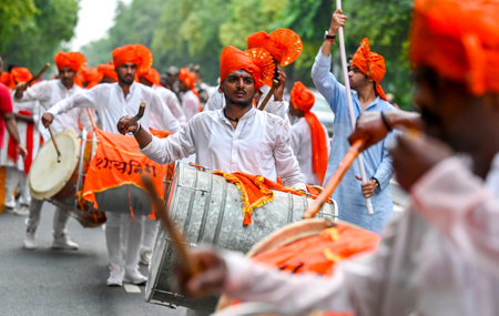 NEW DELHI INDIA SEPTEMBER 17 2024 Hindu Devotees chant as they carry a statue of the Hindu God...