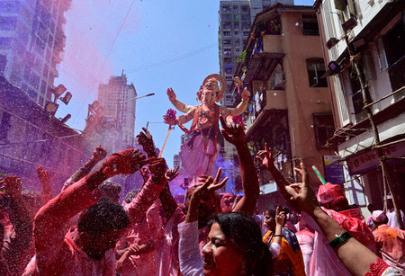 MUMBAI INDIA SEPTEMBER 17 2024 Devotees take Ganpati idol of Lord Ganesha for immersion at Khetwadi...