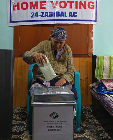 SRINAGAR, INDIA - SEPTEMBER 21: Bibi, 87, casts her vote from home, as the Election Commission of India (ECI) initiated a home voting facility for the elderly in the ongoing Jammu and Kashmir Assembly elections on September 21, 2024 in Srinagar, India. (Pのeditorial素材